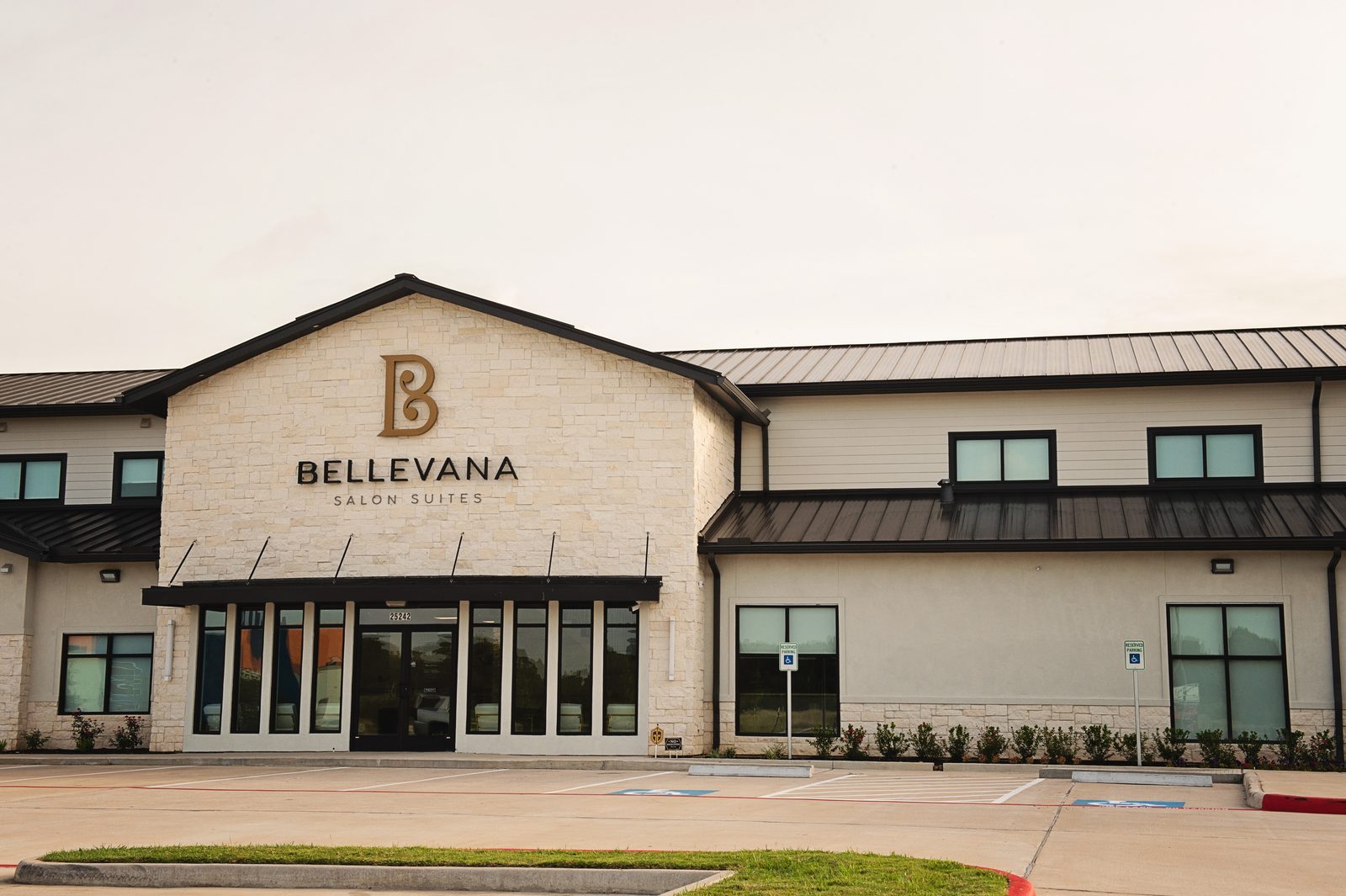 Front entrance of Bellevana Salon Suites with the gold B logo and Bellevana Salon Suites sign in Katy, Texas
