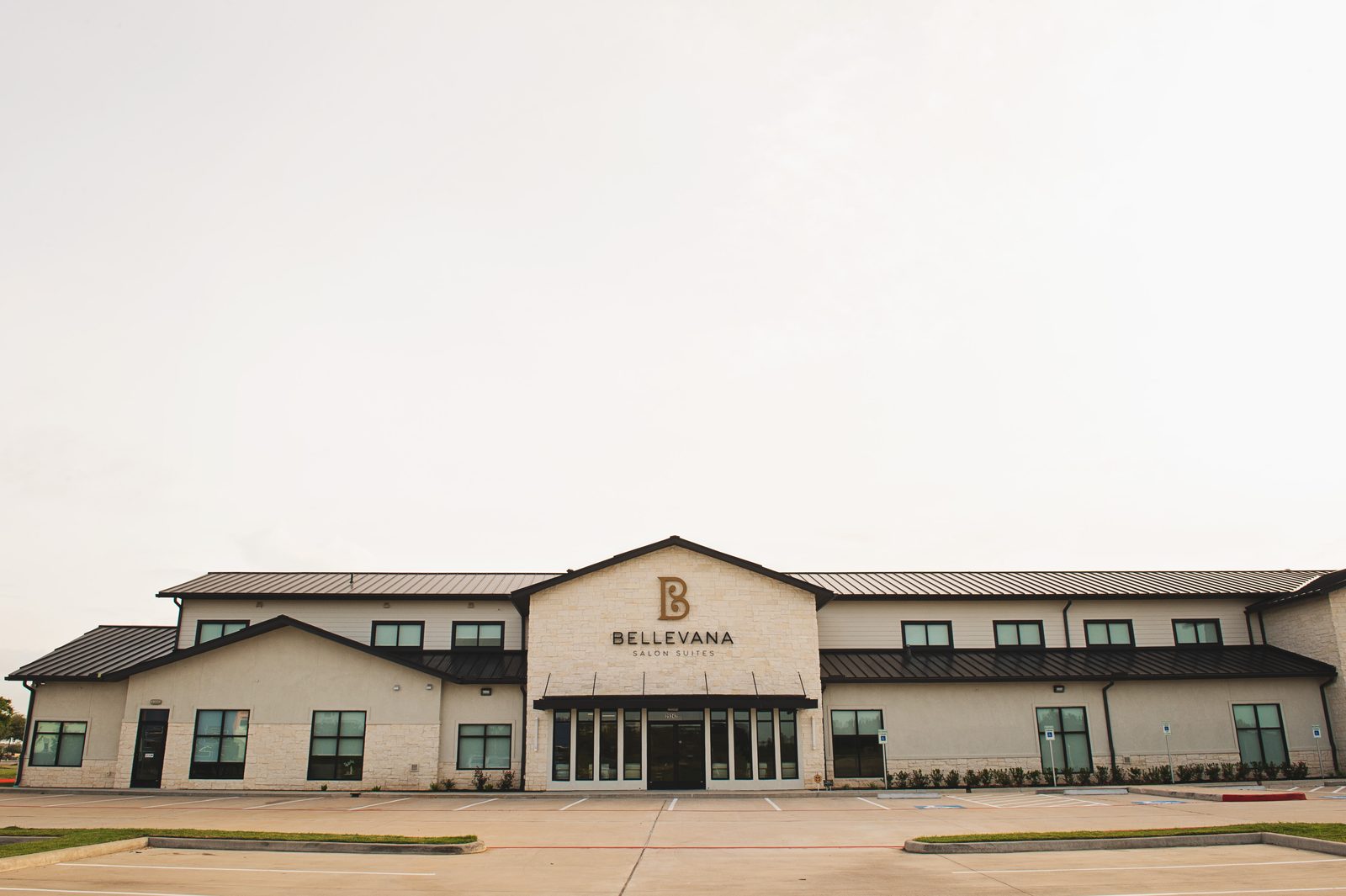 Full front view of the two-story Bellevana Salon Suites building on Kingsland Blvd